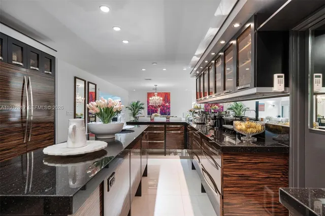 a kitchen filled with a chandelier