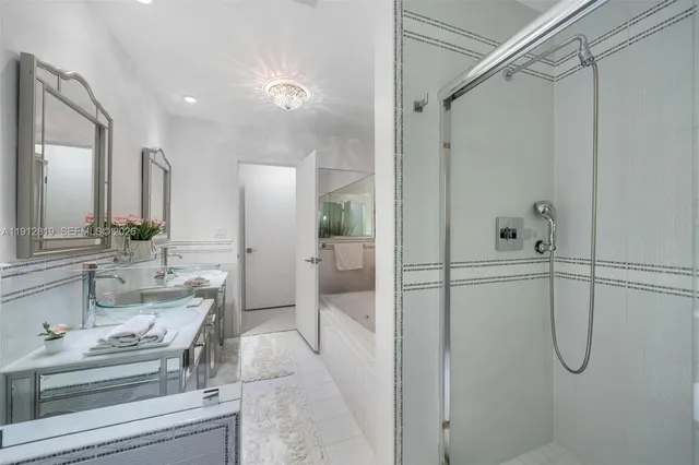 a view of a patio with chairs and potted plants