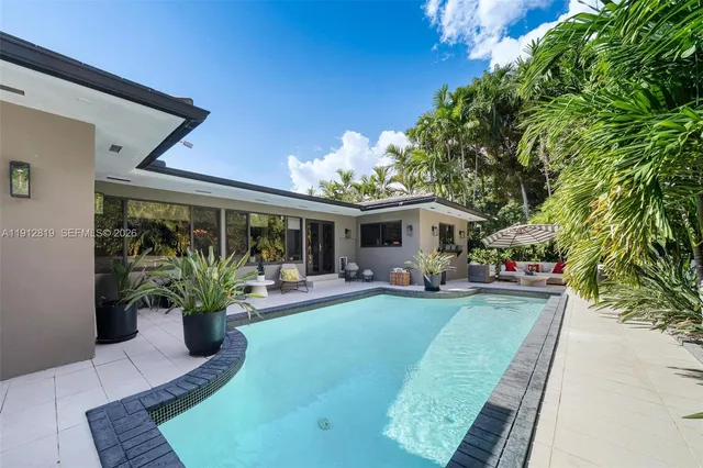 an aerial view of a house with a garden