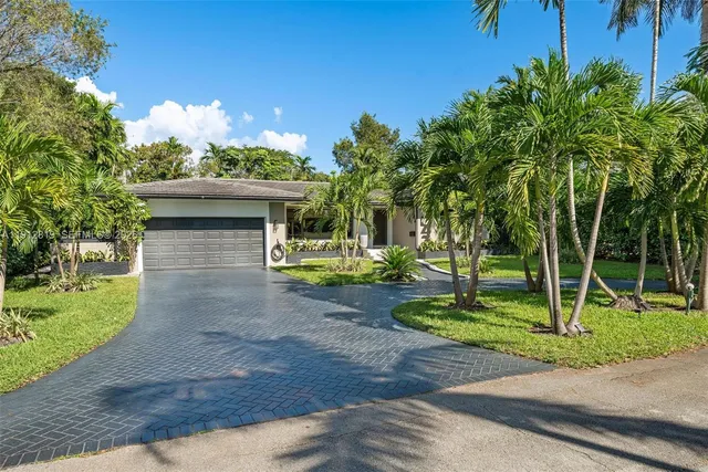an aerial view of a house with a garden