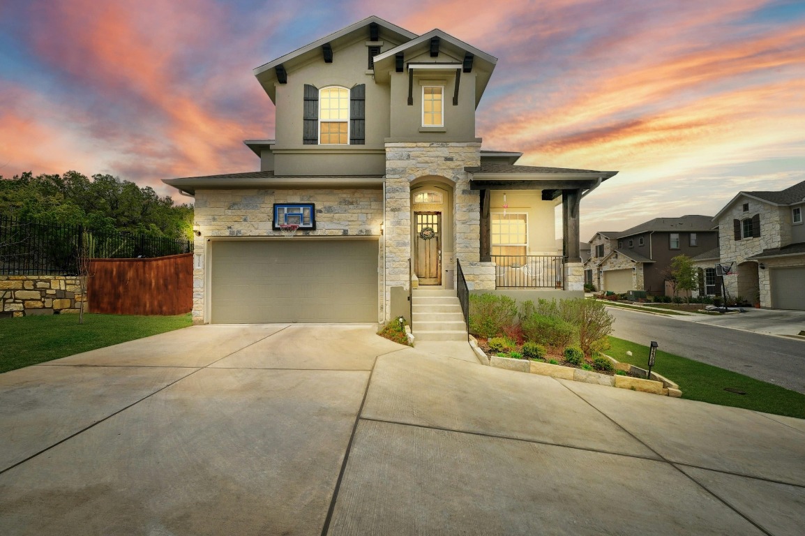 12308 Simmental Drive, Unit 94 Austin, TX 78732 - Photo 1 of 34 a front view of a house with a yard