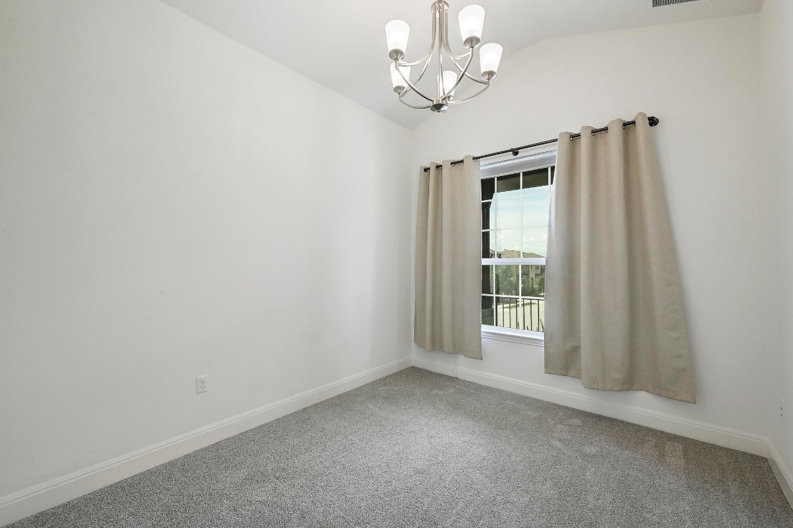 12308 Simmental Drive, Unit 94 Austin, TX 78732 - Photo 16 of 34 wooden floor in an empty room with a window