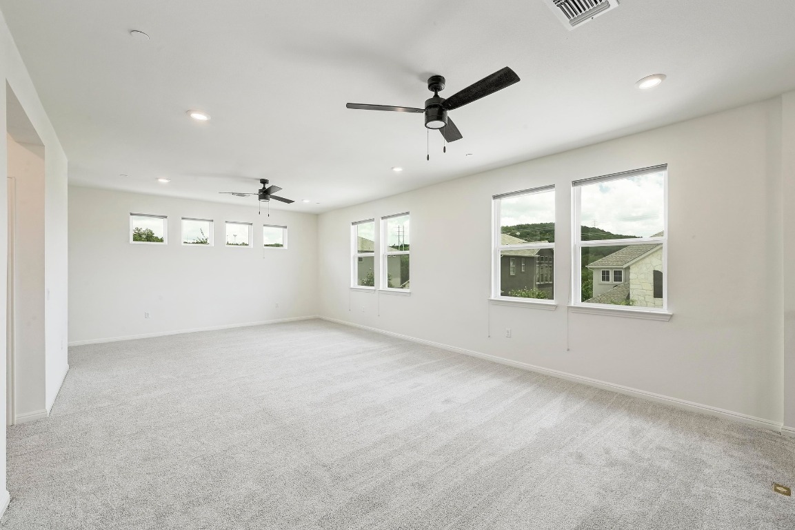12308 Simmental Drive, Unit 94 Austin, TX 78732 - Photo 17 of 34 a view of an empty room with a window