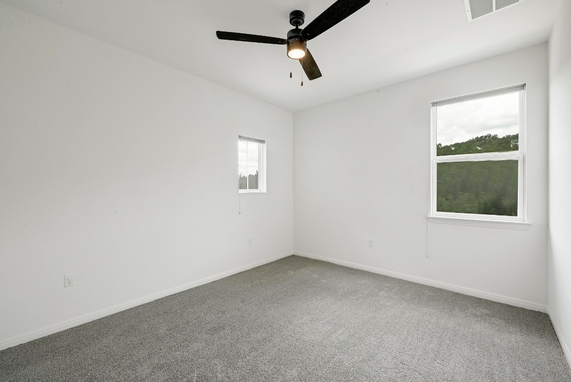 12308 Simmental Drive, Unit 94 Austin, TX 78732 - Photo 21 of 34 an empty room with a window