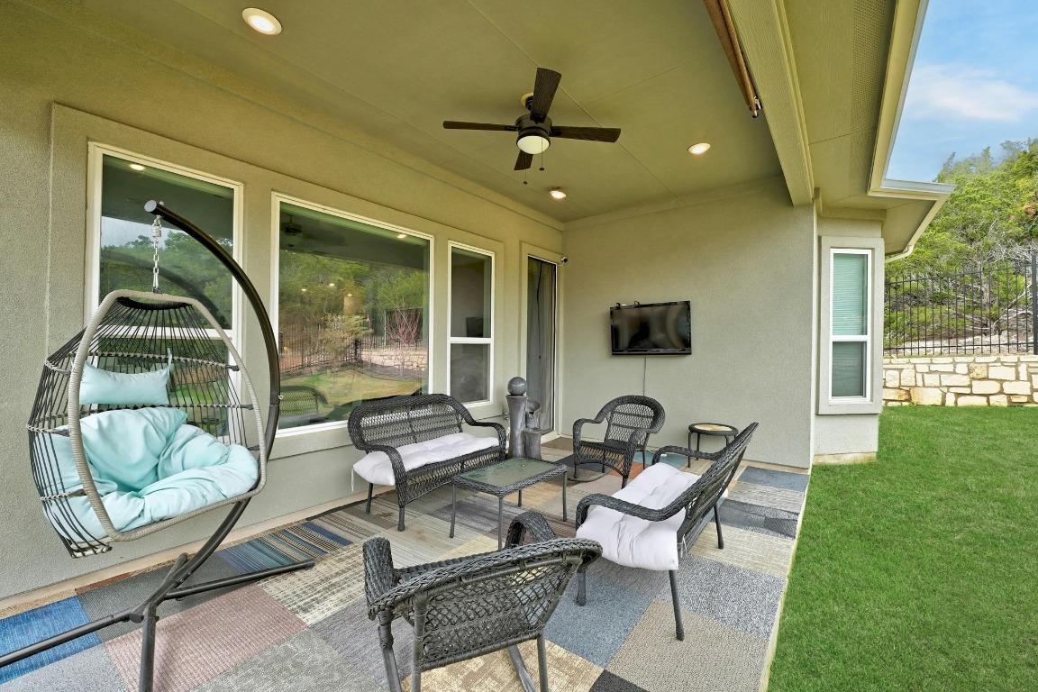 12308 Simmental Drive, Unit 94 Austin, TX 78732 - Photo 26 of 34 a living room with furniture and a window