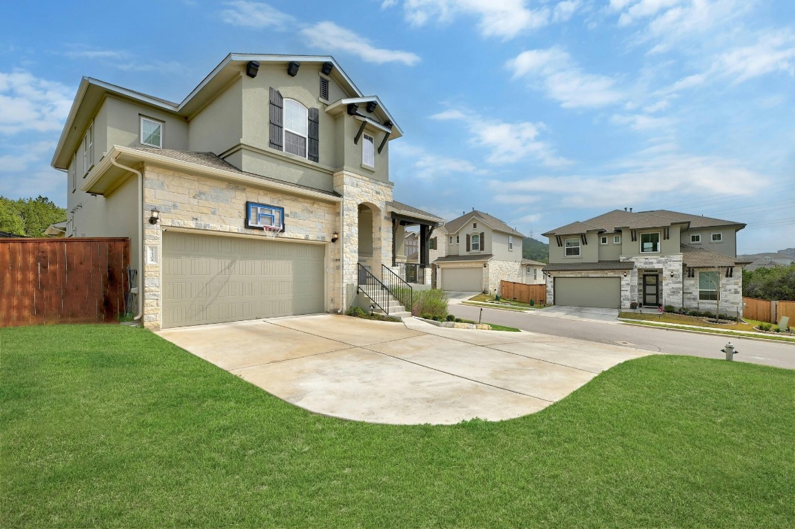 12308 Simmental Drive, Unit 94 Austin, TX 78732 - Photo 3 of 34 a front view of a house with a yard