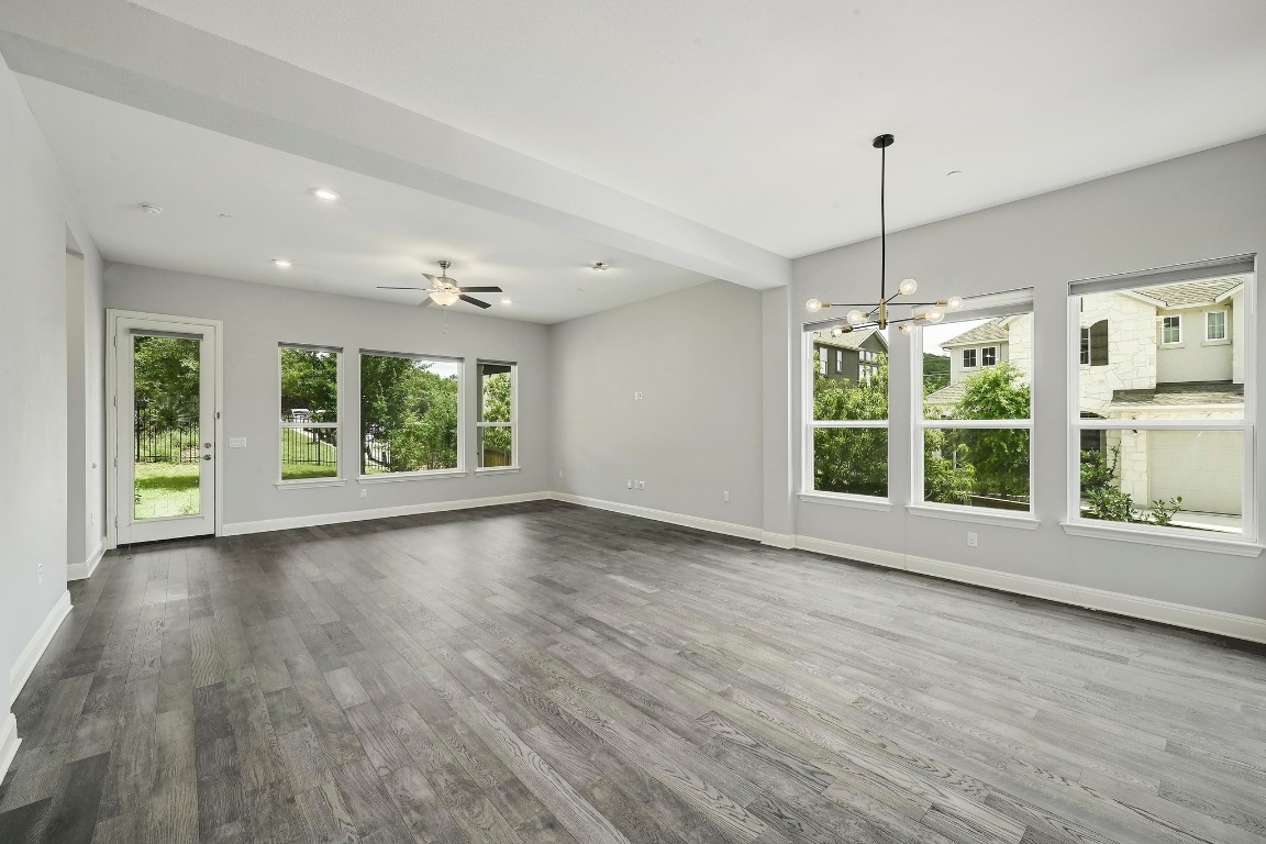 12308 Simmental Drive, Unit 94 Austin, TX 78732 - Photo 4 of 34 a view of an empty room with wooden floor and a window