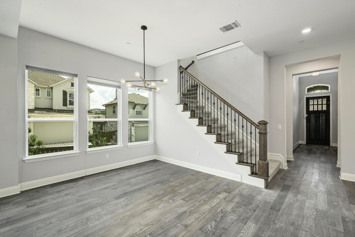 12308 Simmental Drive, Unit 94 Austin, TX 78732 - Photo 5 of 34 a view of an entryway with wooden floor and door