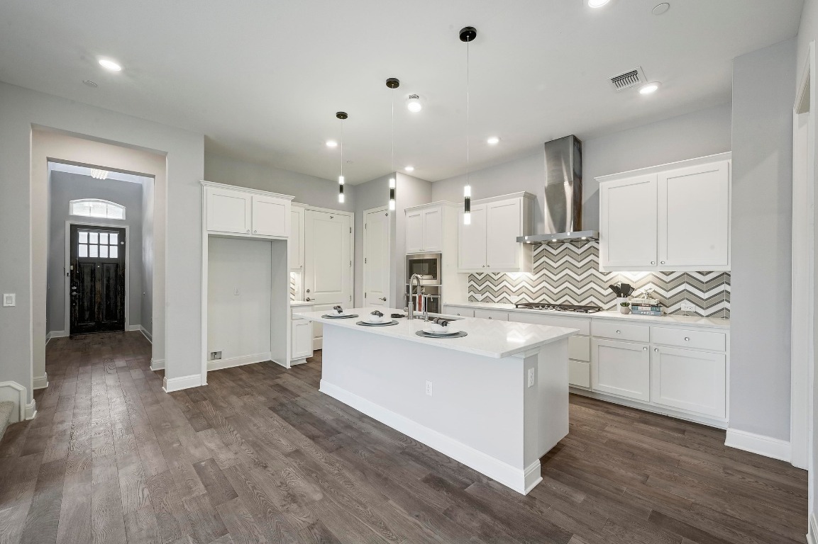 12308 Simmental Drive, Unit 94 Austin, TX 78732 - Photo 6 of 34 a kitchen with kitchen island sink stove and refrigerator