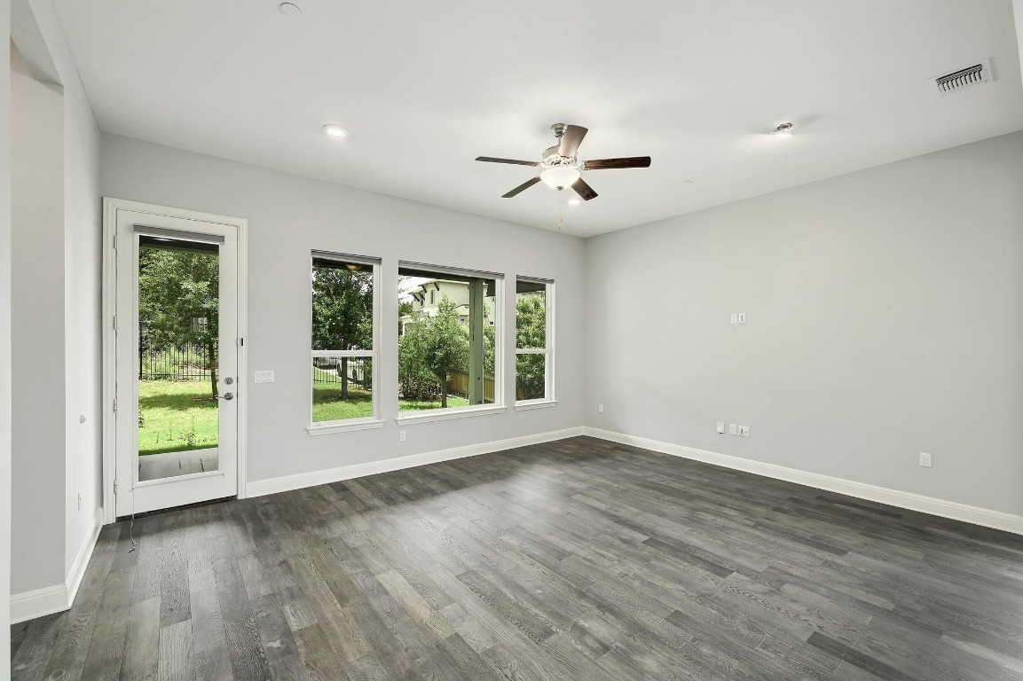 12308 Simmental Drive, Unit 94 Austin, TX 78732 - Photo 9 of 34 a view of room with window ceiling fan and hardwood floor