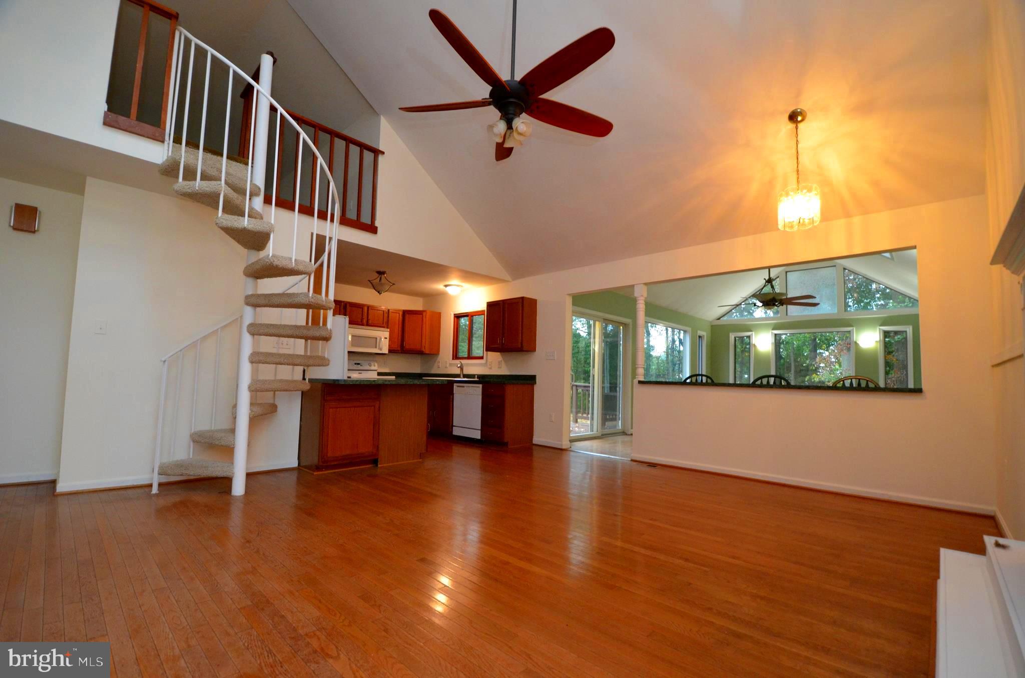 6021 Drum Point Road Deale, MD 20751 - Photo 4 of 53 Family room with spiral staircase