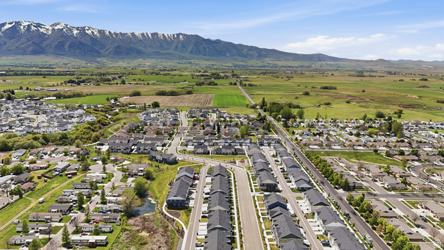 1173 West 1870 South Logan, UT 84321 - Photo 32 of 33 Expansive aerial view showcasing a residential area with a prominent mountain range backdrop