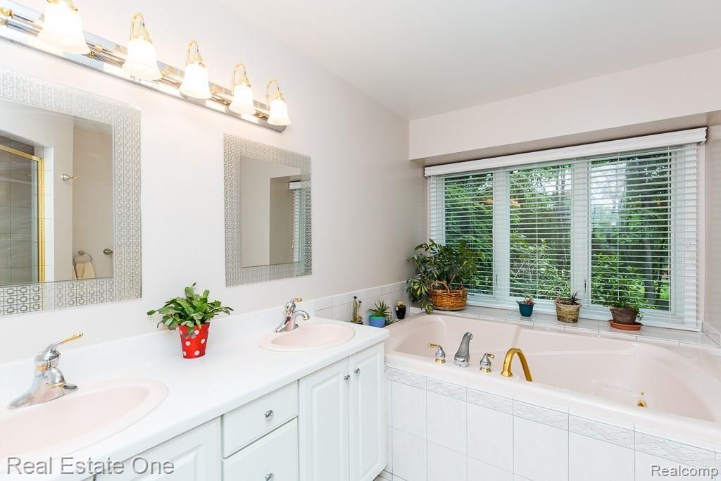 3815 Orion Road Oakland, MI 48363 - Photo 14 of 36 Mater Bath features Dual Vanities, Huge Jetted Tub (supported by Dual Hot Water Heaters)