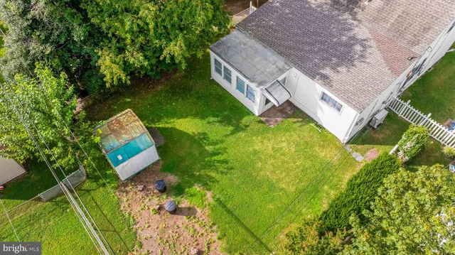 an aerial view of house with yard
