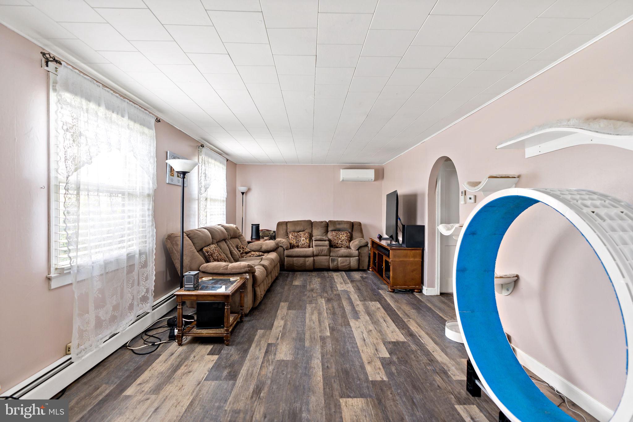 3421 Cornwall Road Dundalk, MD 21222 - Photo 17 of 45 a living room with furniture and a wooden floor