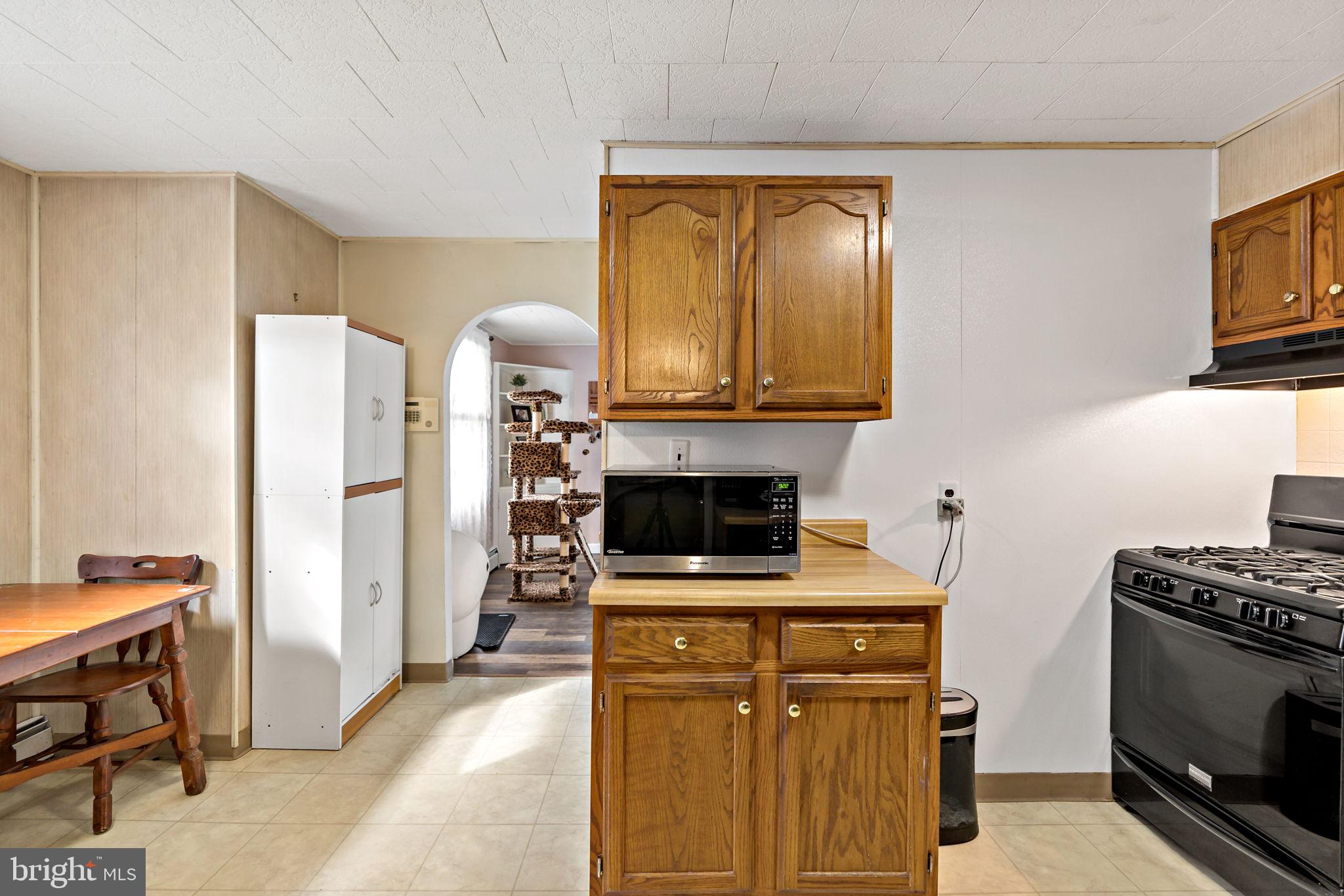 3421 Cornwall Road Dundalk, MD 21222 - Photo 22 of 45 a kitchen with a stove and a microwave