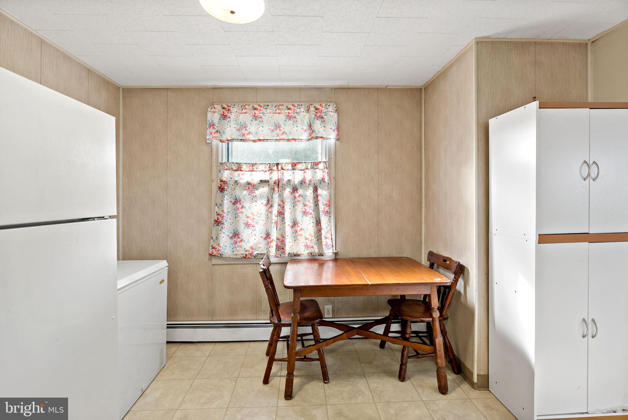 3421 Cornwall Road Dundalk, MD 21222 - Photo 23 of 45 a dining room with furniture and window
