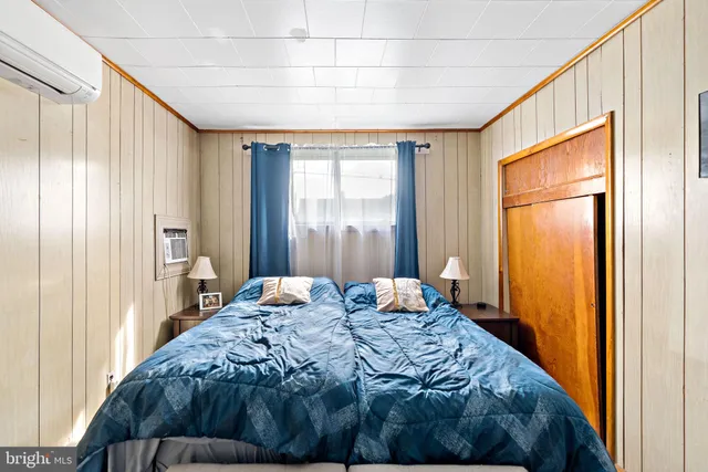 a bedroom with a bed and a closet