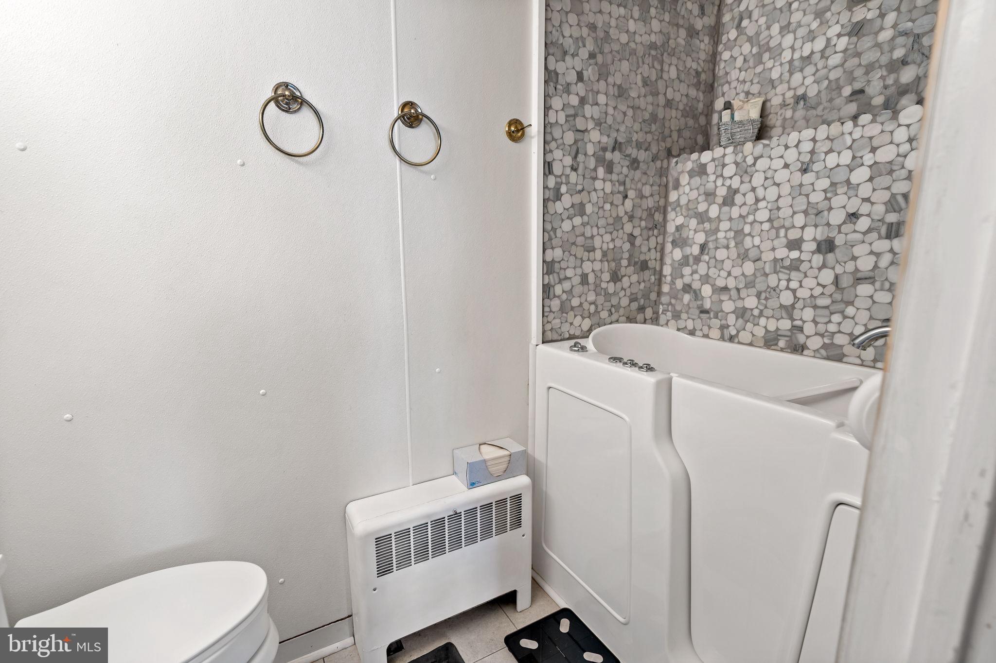 3421 Cornwall Road Dundalk, MD 21222 - Photo 34 of 45 a bathroom with a toilet and a shower