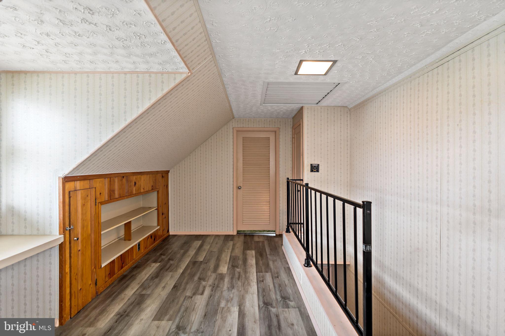 3421 Cornwall Road Dundalk, MD 21222 - Photo 37 of 45 a view of a hallway with wooden floor and staircase