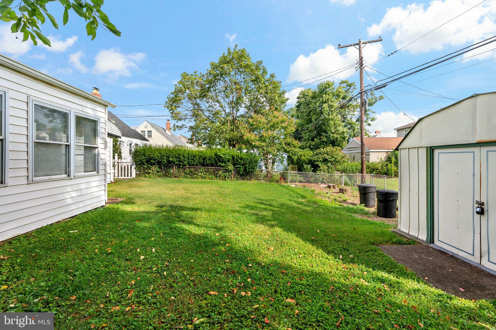 3421 Cornwall Road Dundalk, MD 21222 - Photo 7 of 45 a view of a house with a yard