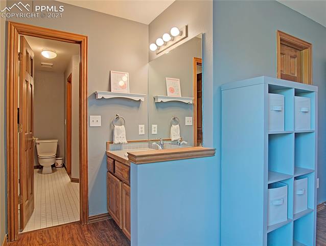 735 Winding Hills Road Monument, CO 80132 - Photo 27 of 42 Bedroom #2 vanity and entrance into Jack & Jill full bathroom.