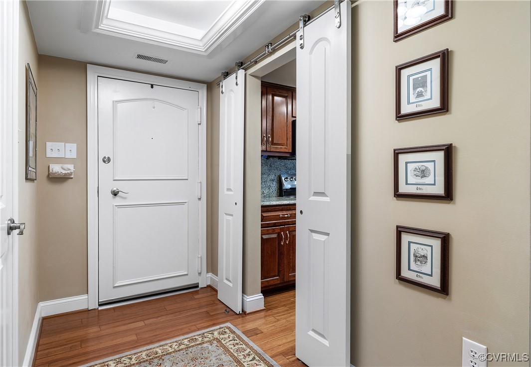 2956 Hathaway Road, Unit 803 Richmond, VA 23225 - Photo 5 of 27 Foyer with barn door, open to kitchen