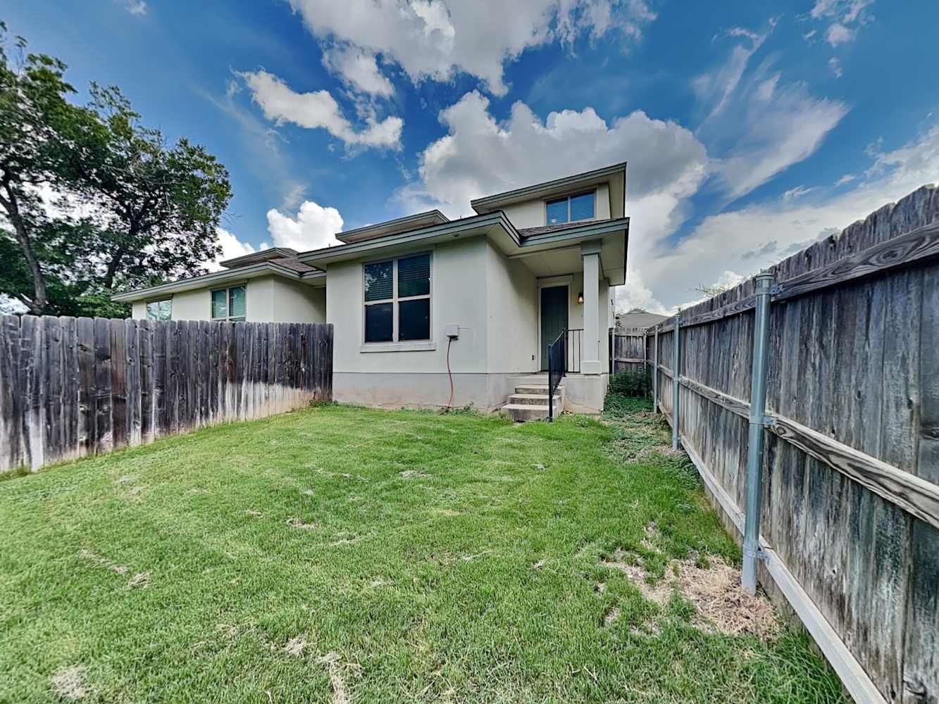 179 Holly Street, Unit 201 Georgetown, TX 78626 - Photo 17 of 17 a house view with a garden space