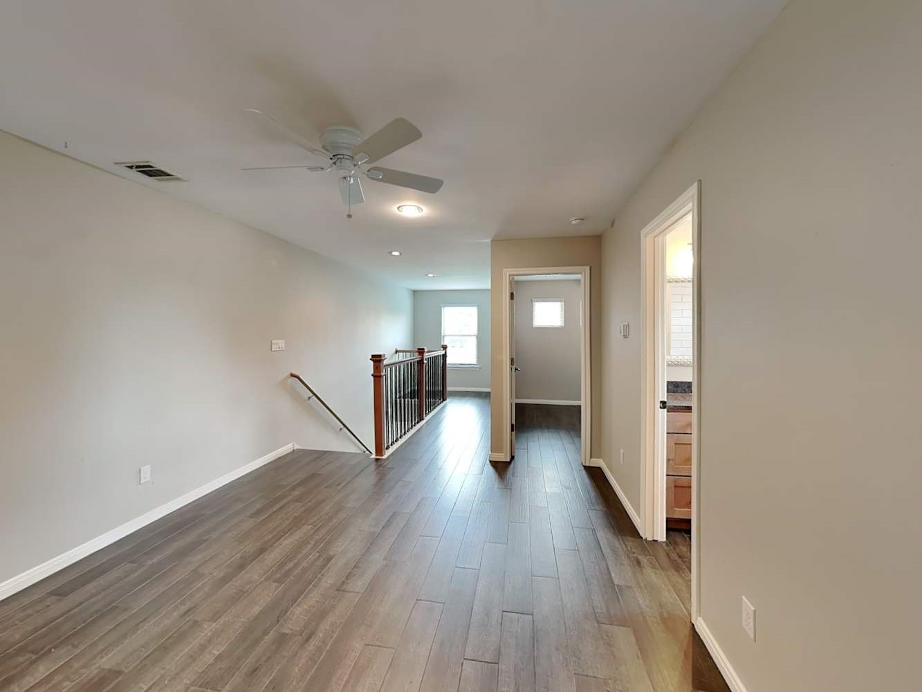 179 Holly Street, Unit 201 Georgetown, TX 78626 - Photo 4 of 17 a view of a hallway with wooden floor