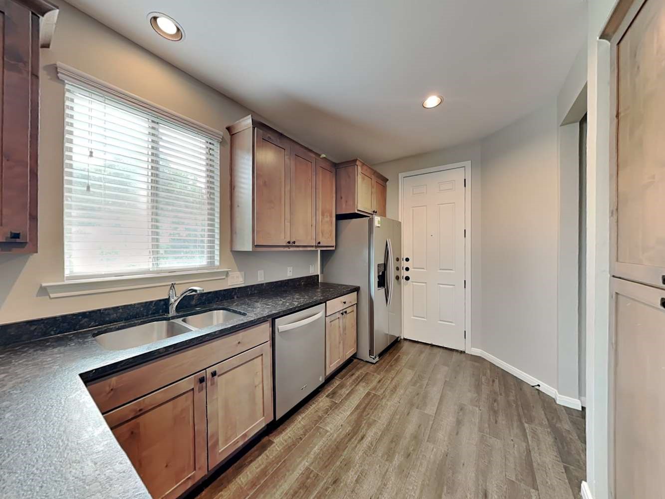 179 Holly Street, Unit 201 Georgetown, TX 78626 - Photo 7 of 17 a kitchen with a sink a window and appliances