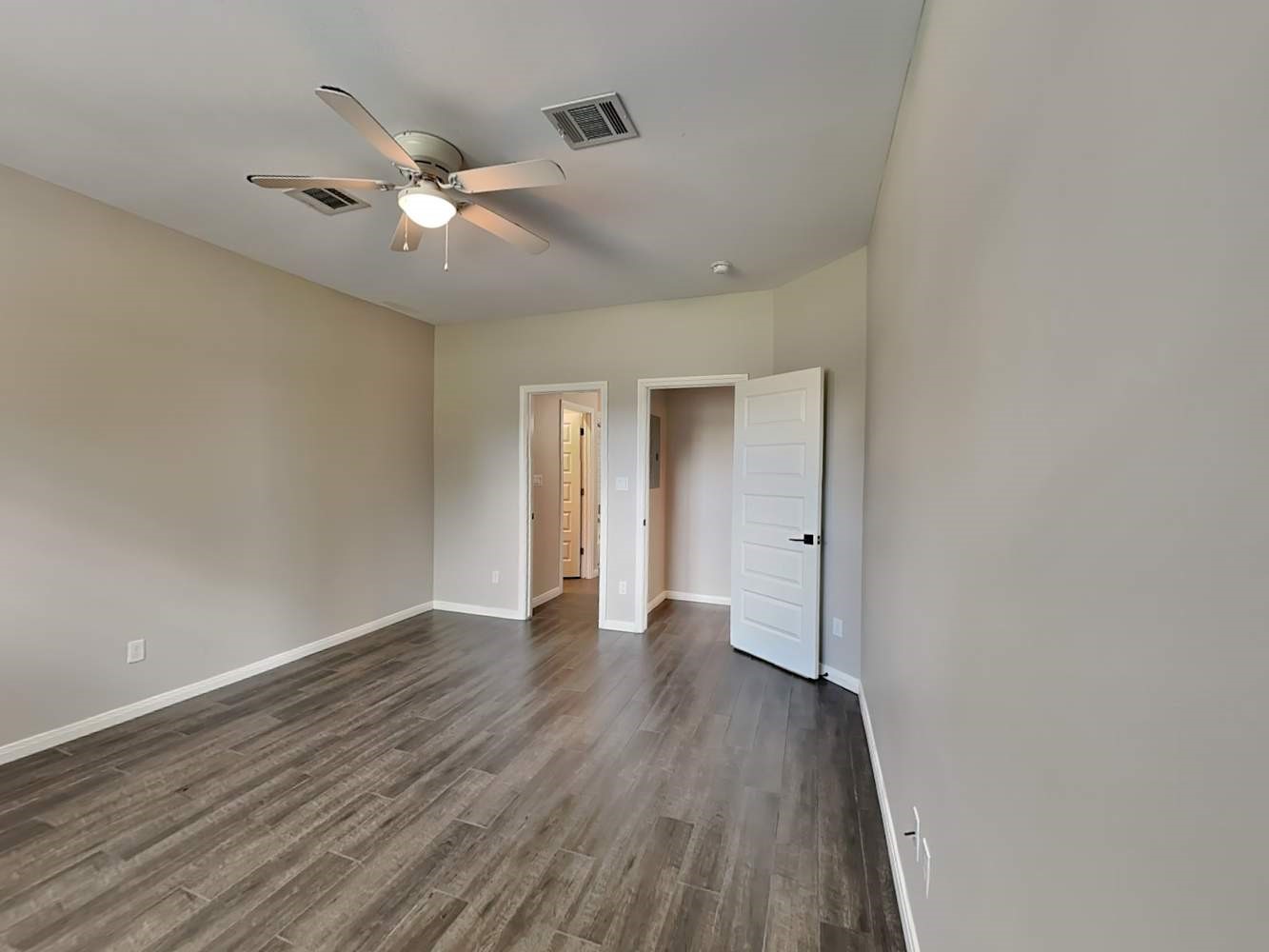 179 Holly Street, Unit 201 Georgetown, TX 78626 - Photo 9 of 17 a view of an empty room and wooden floor