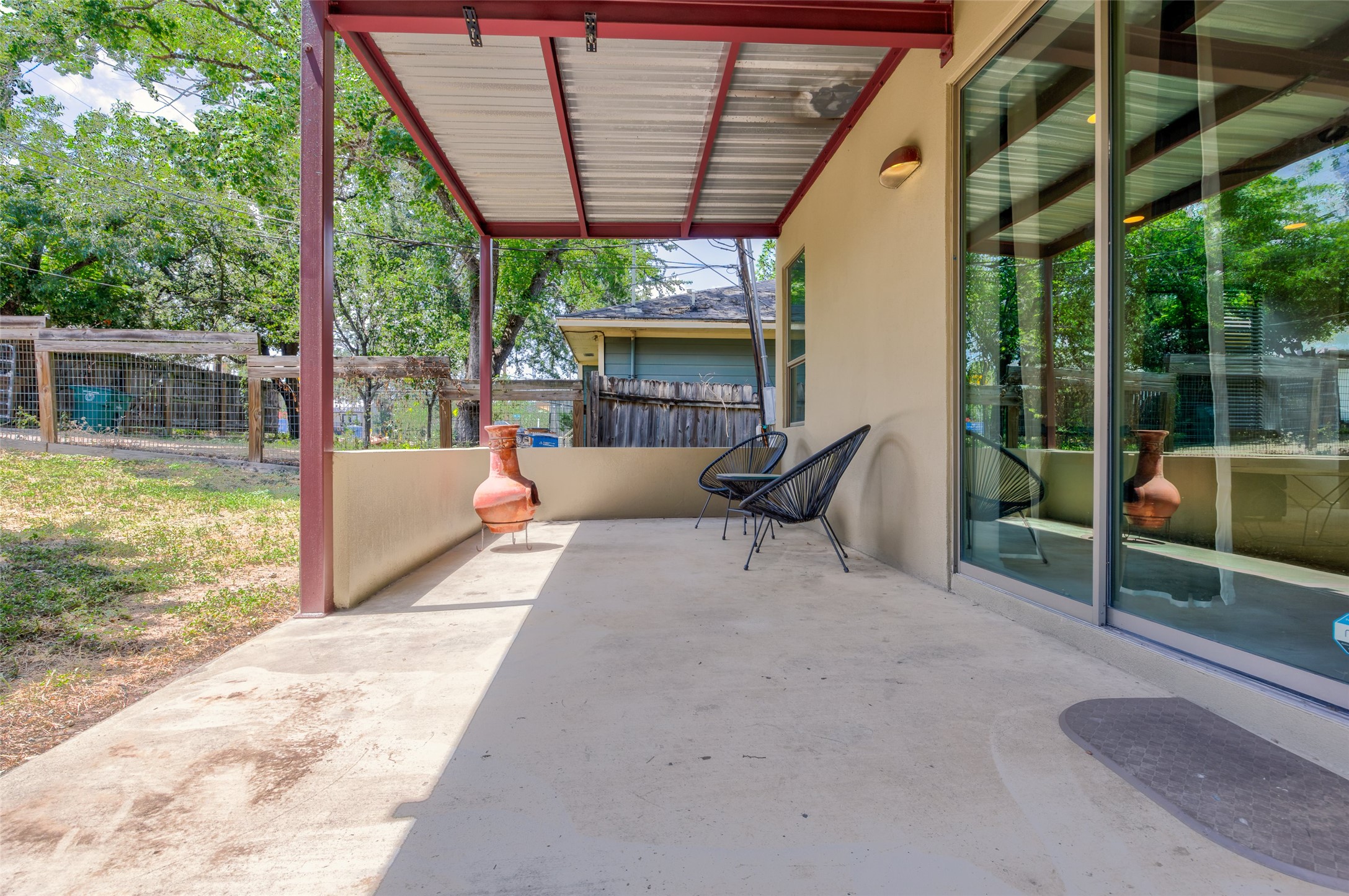 1305 Chestnut Avenue Austin, TX 78702 - Photo 37 of 40 A spacious covered patio invites relaxation with ample room for outdoor furnishings.