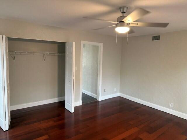 103 Northeast 28th Street Boca Raton, FL 33431 - Photo 23 of 47 an empty room with wooden floor and fan