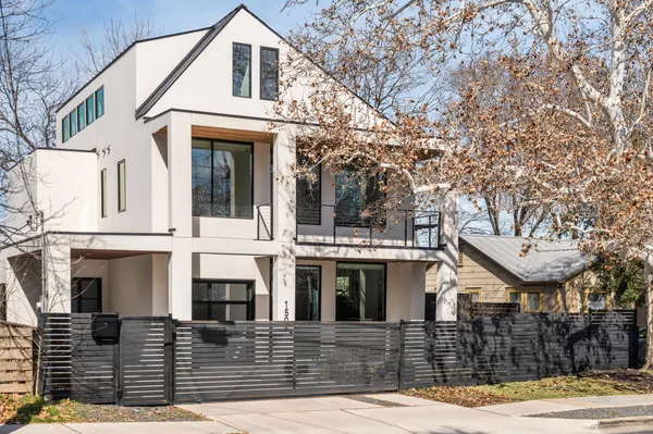 a front view of a house with glass windows