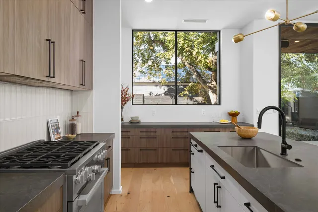 a spacious bedroom with a large bed and a large window