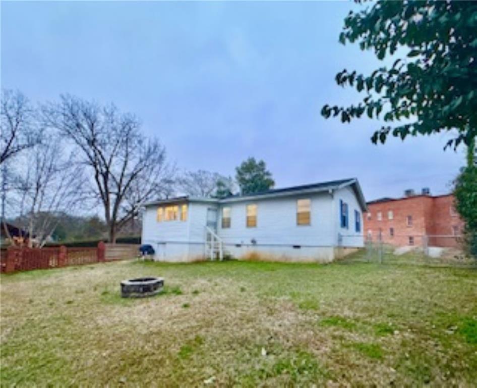 209 Moultrie Lane Southwest Rome, GA 30161 - Photo 12 of 46 a view of a backyard with a house in the background