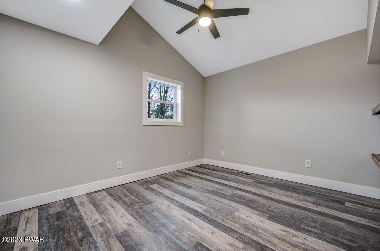 16 Pond Road Moscow, PA 18444 - Photo 22 of 55 a view of a room with a fan and wooden floor