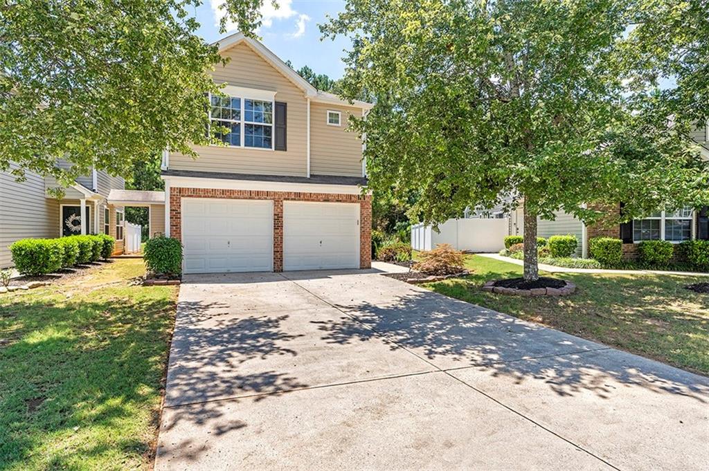 6145 Smoke Ridge Lane Cumming, GA 30041 - Photo 1 of 1 a house view with a backyard space