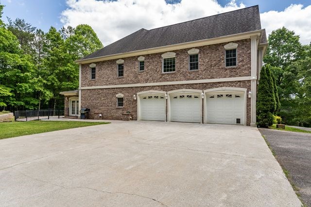1190 Maple Grove Road Morganton, GA 30560 - Photo 17 of 96 a front view of a house with a yard and garage