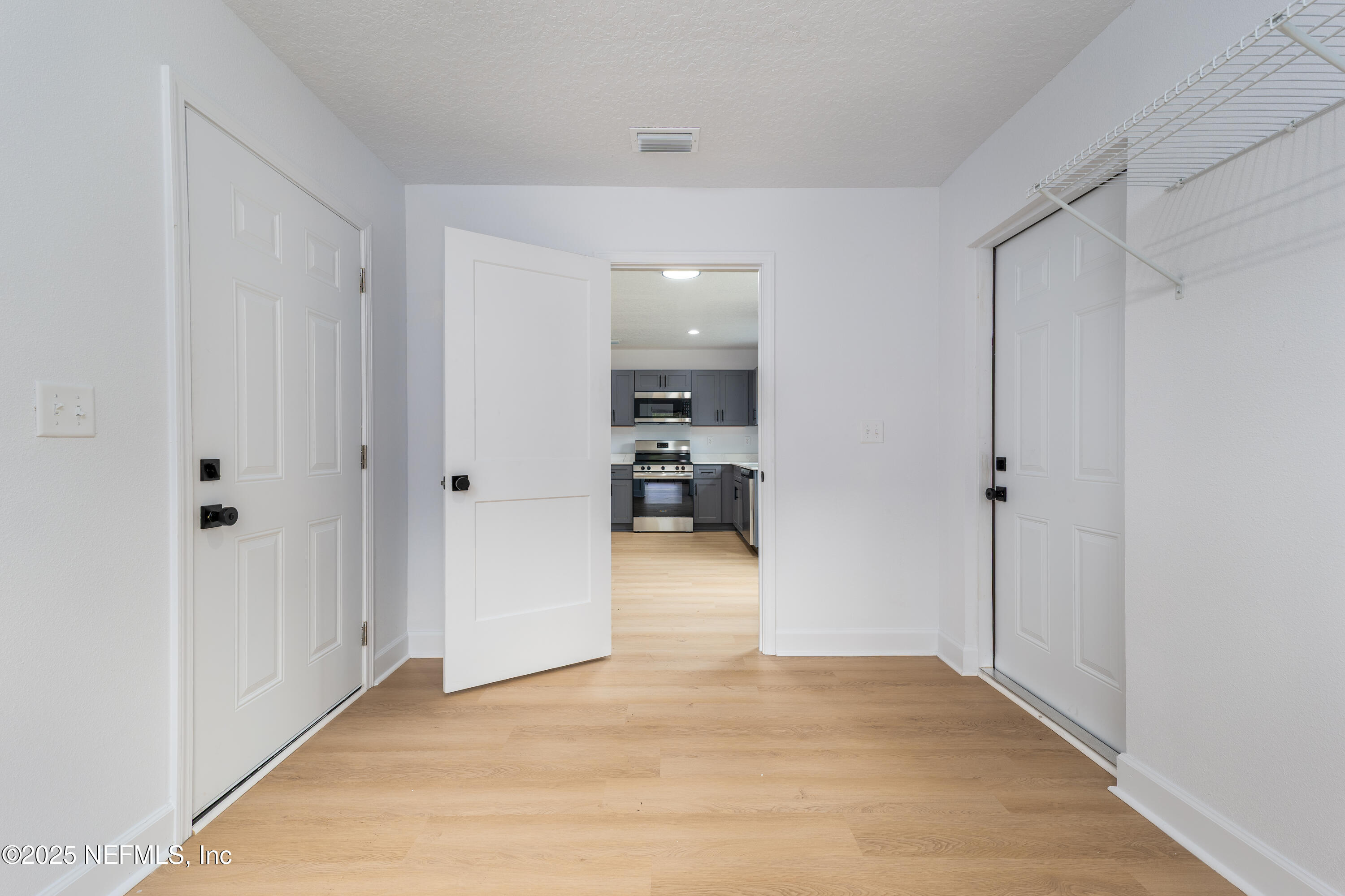 5640 Cherokee Street Keystone Heights, FL 32656 - Photo 17 of 20 a view of hallway with wooden floor