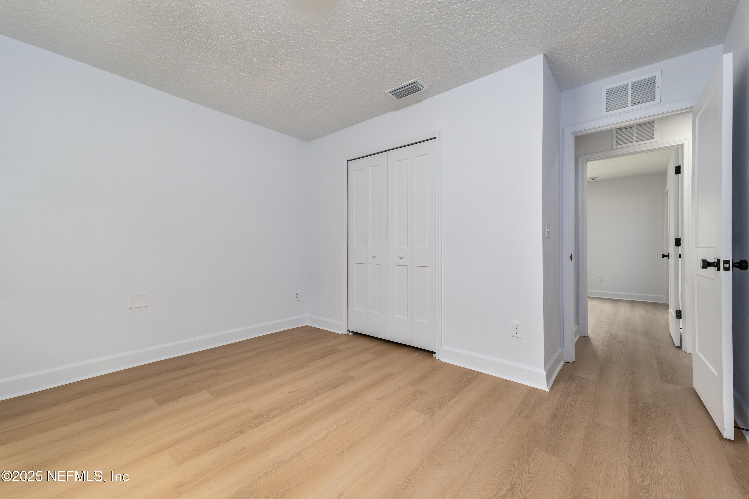 5640 Cherokee Street Keystone Heights, FL 32656 - Photo 8 of 20 wooden floor in an empty room