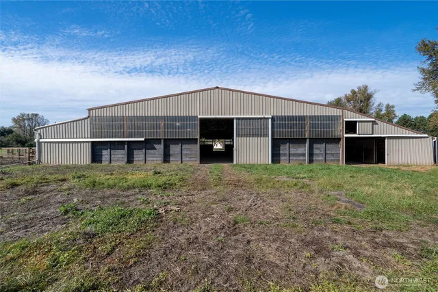 a view of a house with a yard and balcony