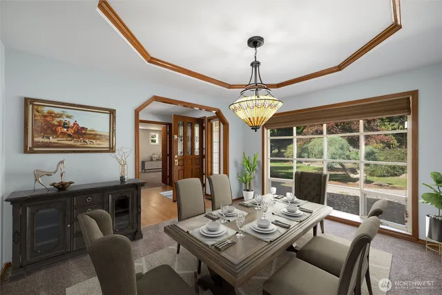 a view of a dining room with furniture window and outside view