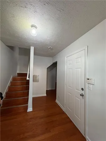 a view of entryway with wooden floor