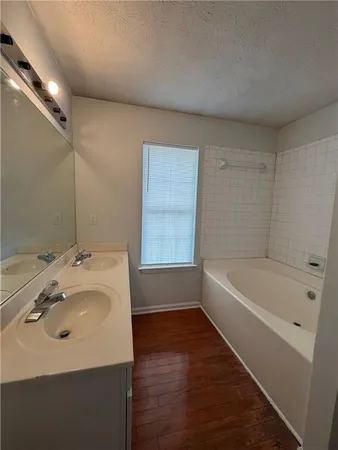 a view of kitchen with stainless steel appliances granite countertop a stove a sink and a refrigerator