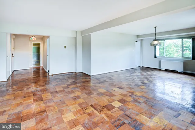 a very nice looking room with a chandelier fan