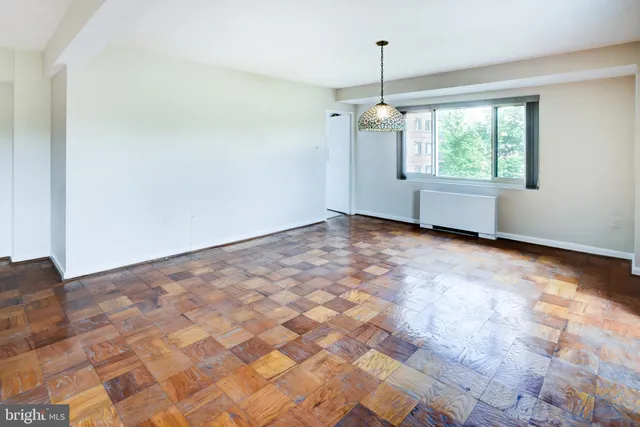 a view of a room with window and chandelier