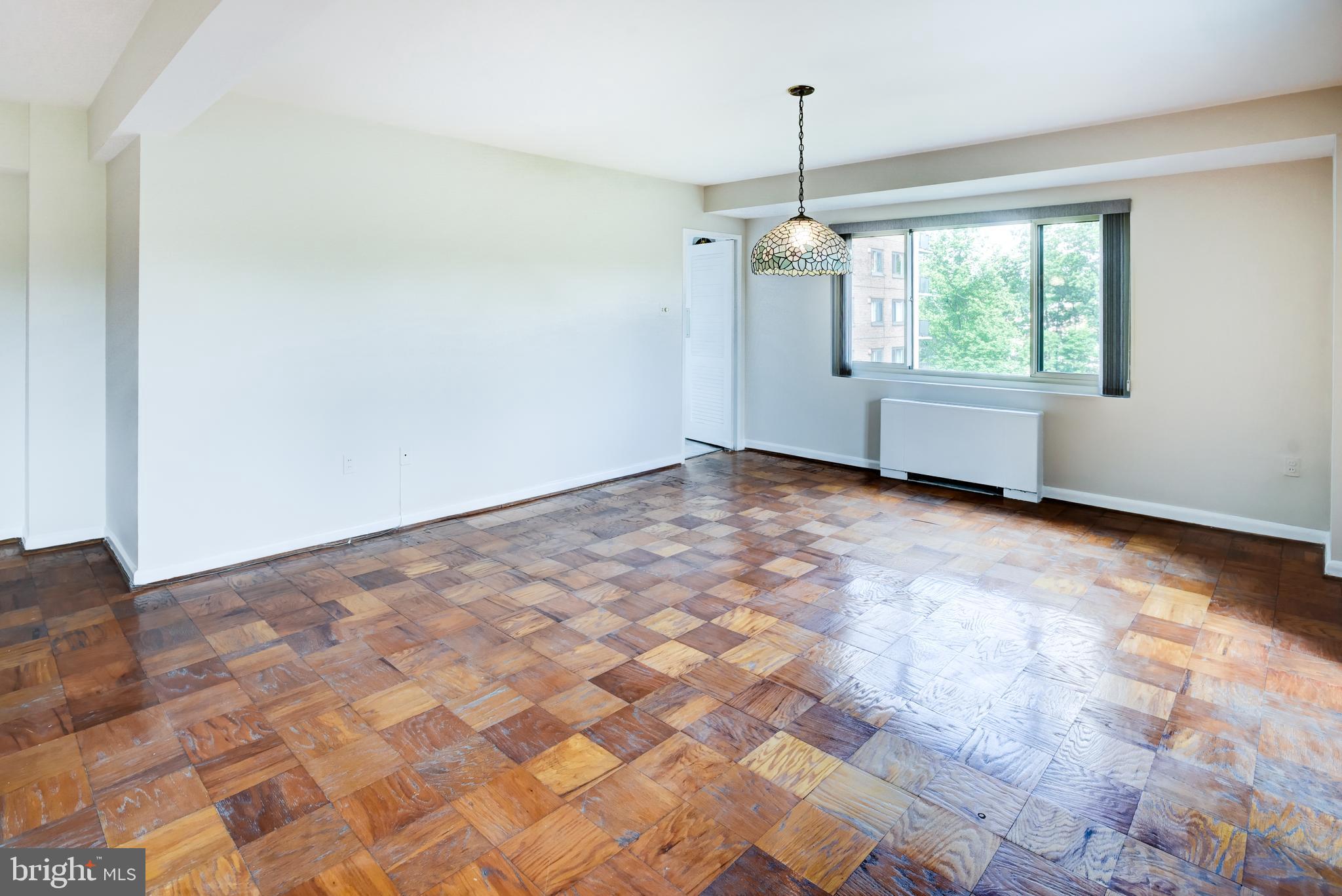 4201 Cathedral Avenue Northwest, Unit 1004E Washington, DC 20016 - Photo 16 of 69 a view of an empty room with a window