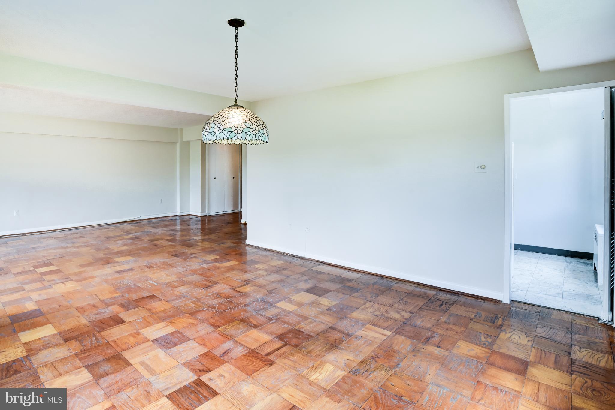 4201 Cathedral Avenue Northwest, Unit 1004E Washington, DC 20016 - Photo 17 of 69 a very nice looking room with a chandelier fan