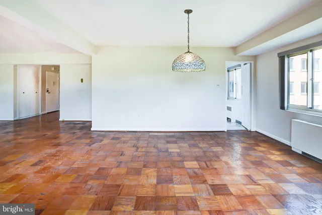 a kitchen with a refrigerator and a stove